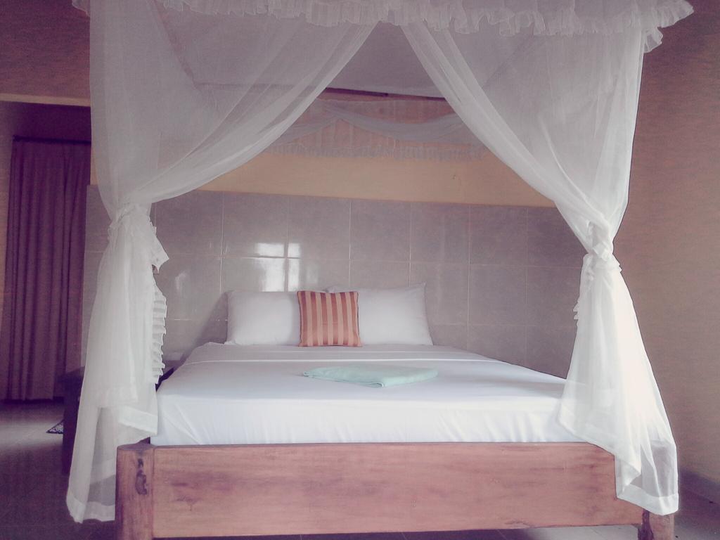Rumahku Homestay Амед Номер фото