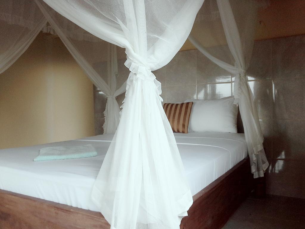 Rumahku Homestay Амед Номер фото
