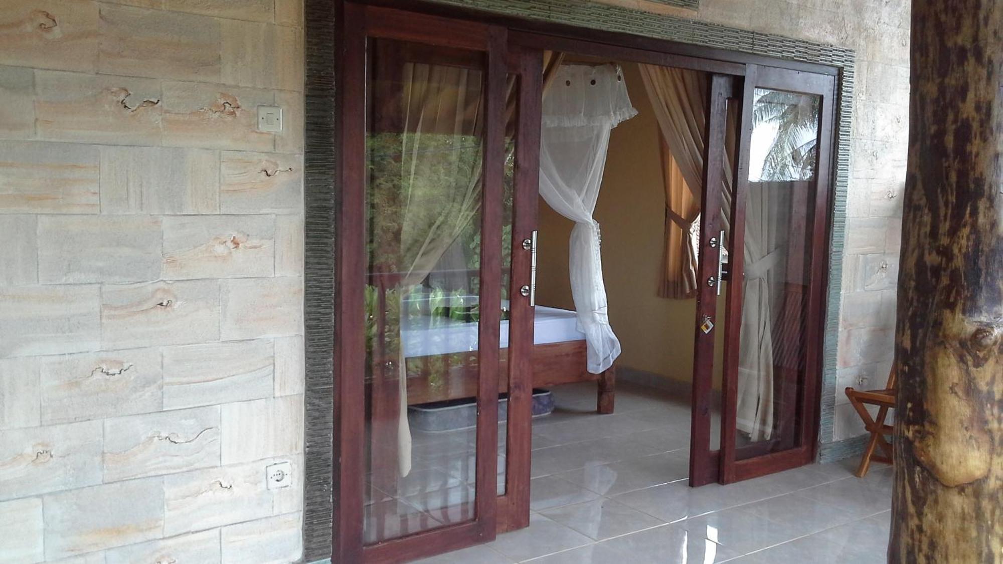 Rumahku Homestay Амед Номер фото